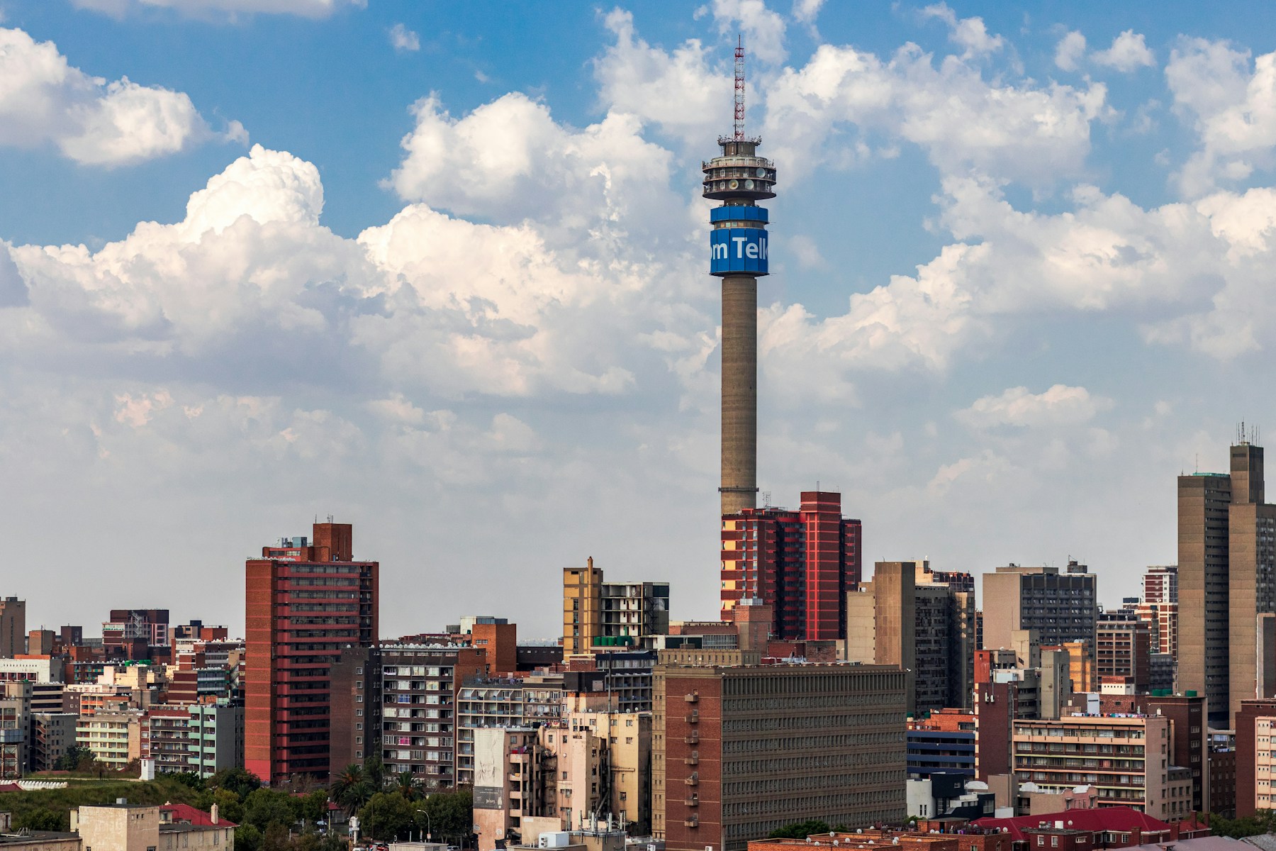 Johannesburg skyline beneath a bright South African sky